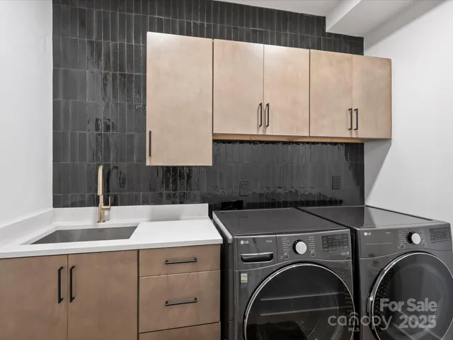 a utility room with dryer and washer