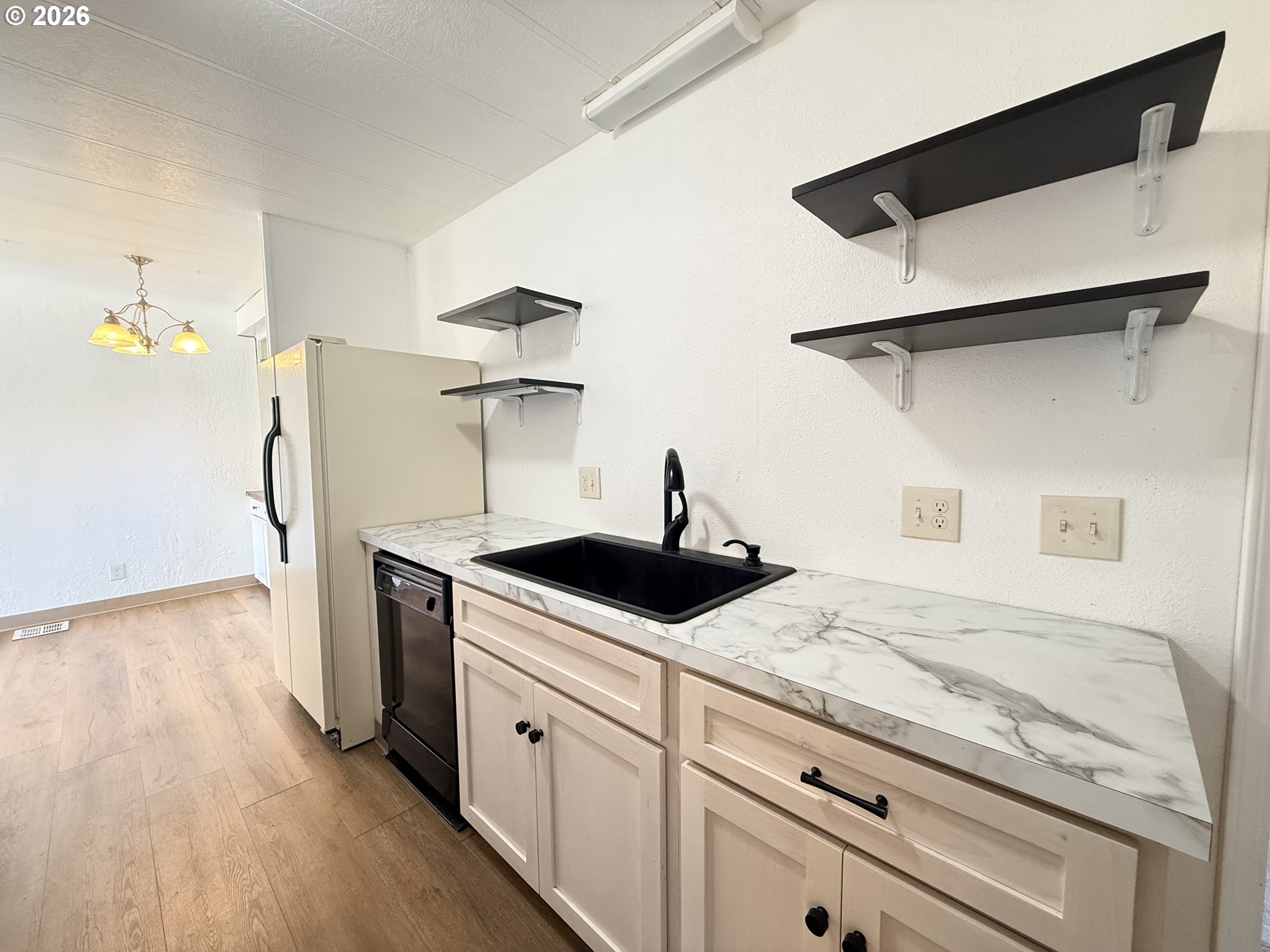 1330 West Sunland Avenue Hermiston, OR 97838 - Photo 6 of 23 a kitchen with granite countertop a stove and a sink