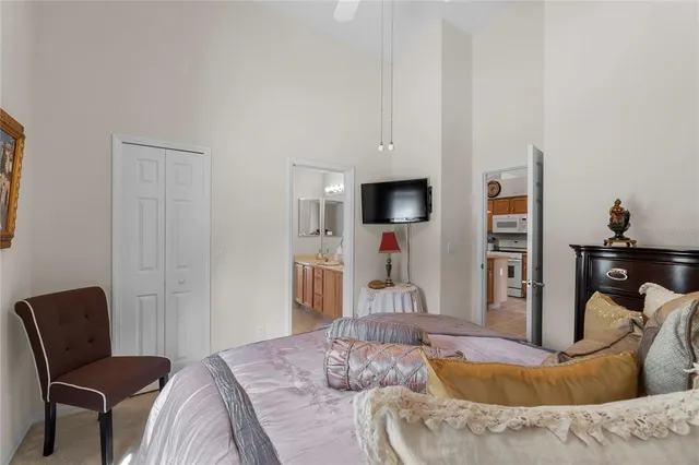 a bedroom with furniture and a flat screen tv