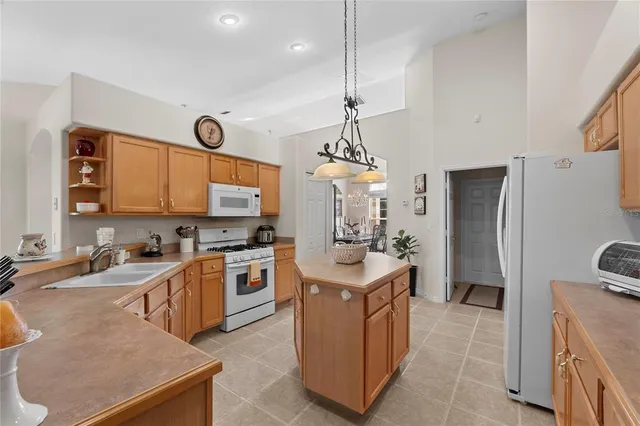 a living room with furniture chandelier and a chandelier