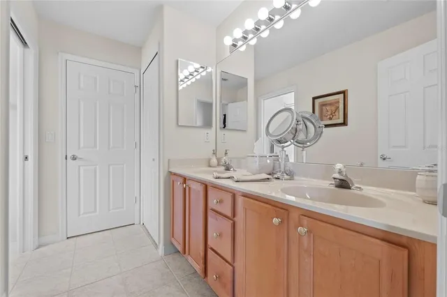 a bathroom with a double vanity sink and a mirror