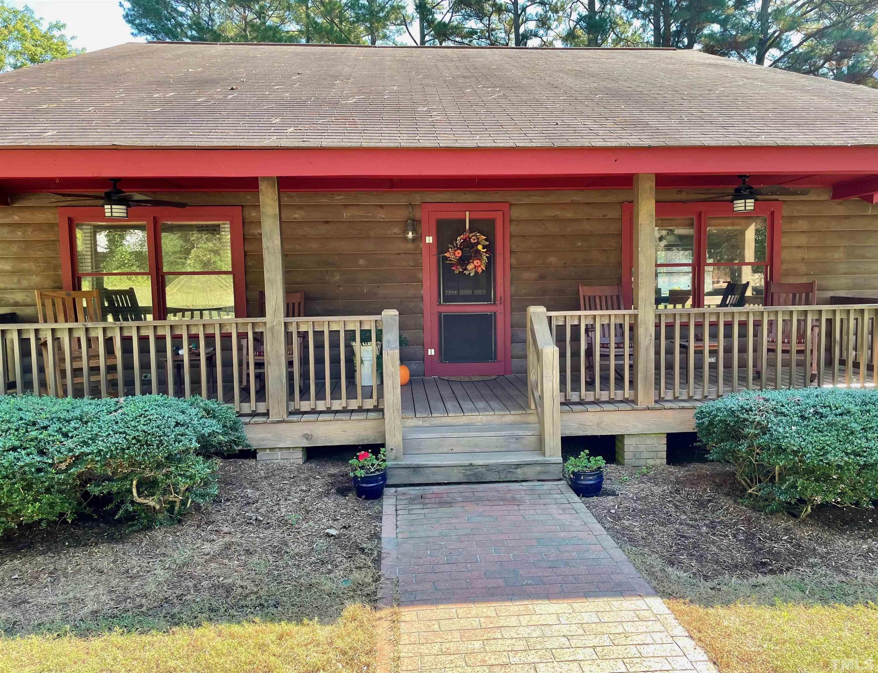 1409 Frazier Road Spring Hope, NC 27882 - Photo 1 of 28 a view of a house with a yard and sitting area