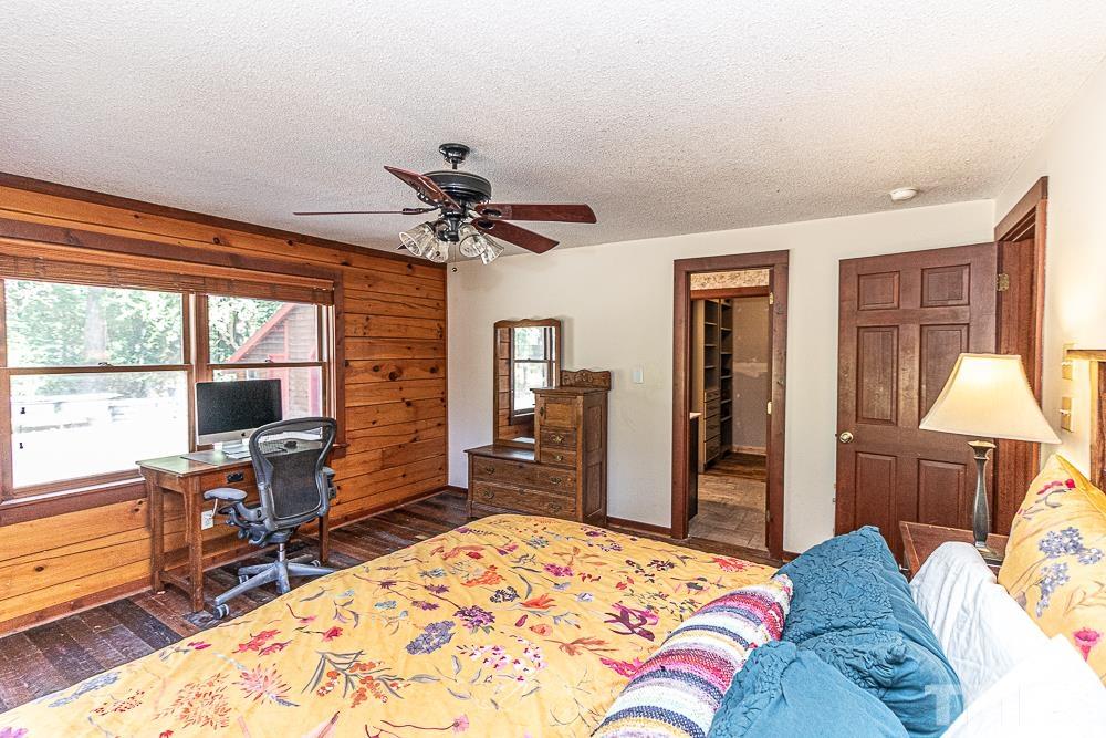 1409 Frazier Road Spring Hope, NC 27882 - Photo 13 of 28 a bedroom with a bed and wooden floor