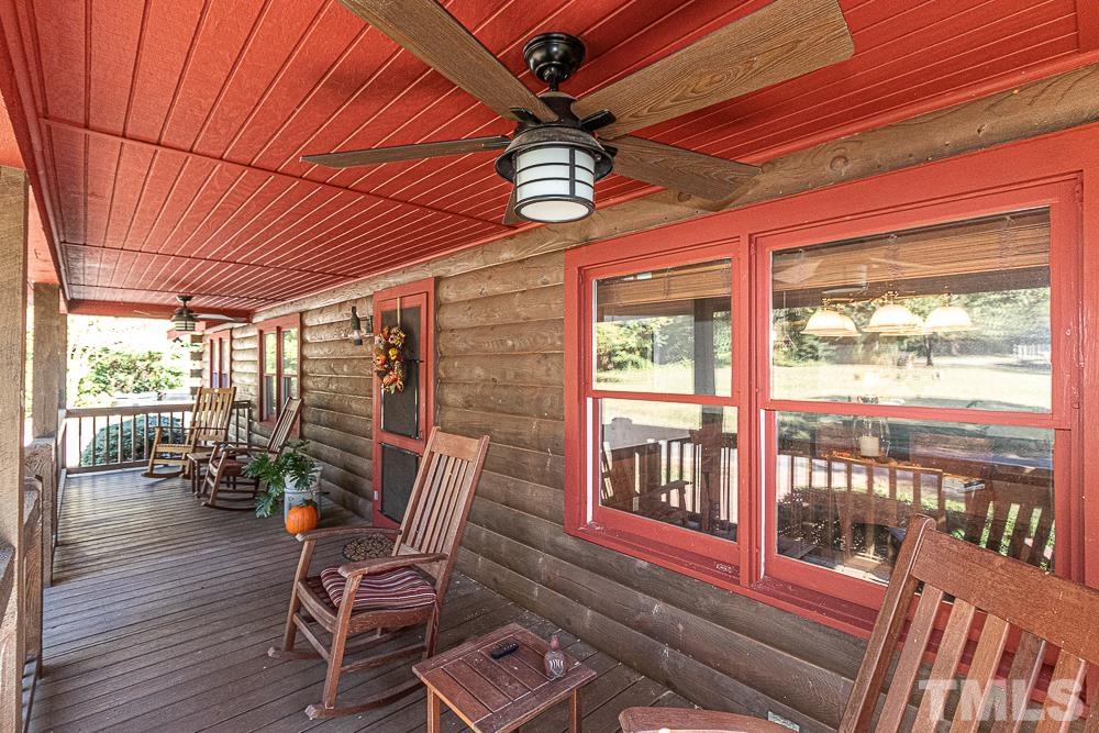1409 Frazier Road Spring Hope, NC 27882 - Photo 14 of 28 a dining room with furniture water view and wooden floor
