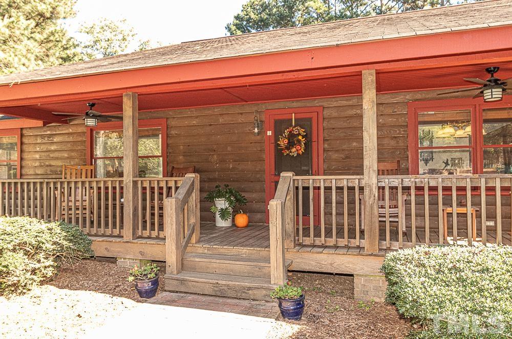 1409 Frazier Road Spring Hope, NC 27882 - Photo 26 of 28 a view of a house with a small yard and wooden floor and fence