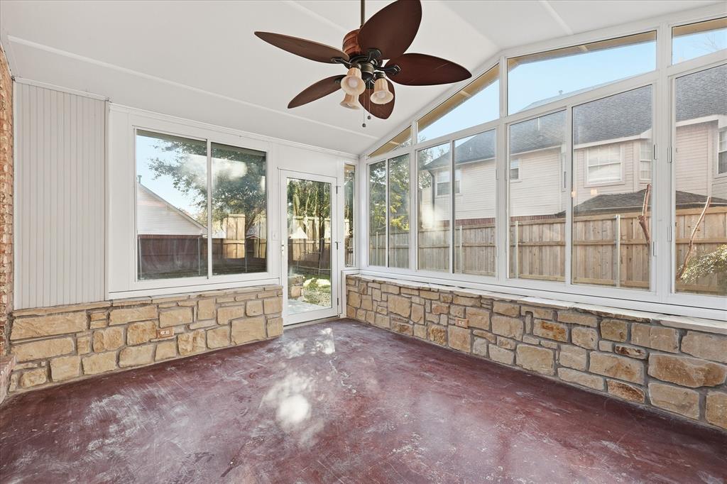 5023 Falcon Hollow Road McKinney, TX 75072 - Photo 22 of 25 Unfurnished sunroom with ceiling fan and lofted ceiling