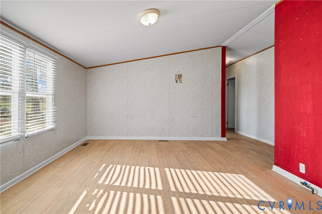 Wood-finish flooring with a white trim, featuring