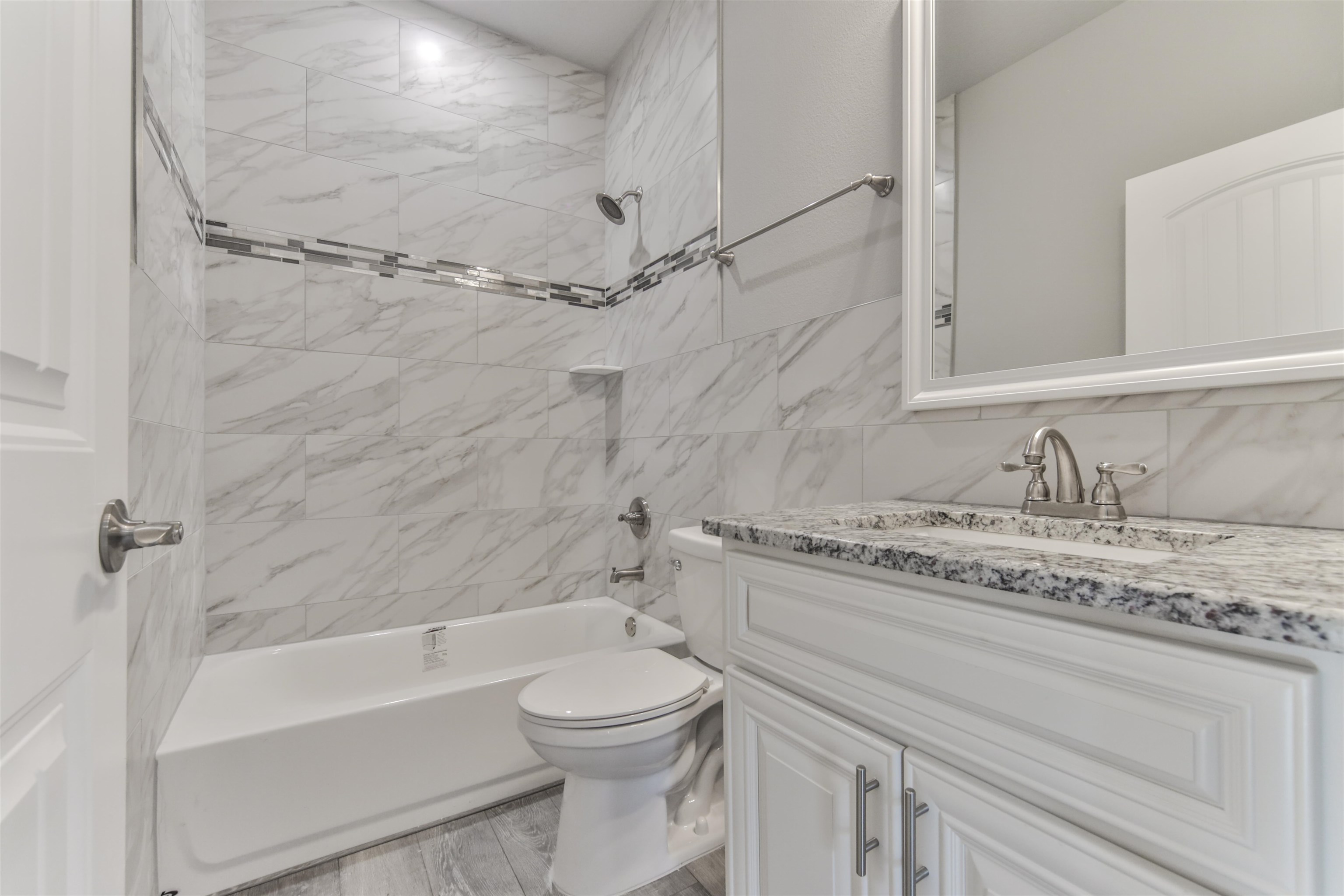 9 Seton Place Palm Coast, FL 32164 - Photo 14 of 37 a bathroom with a granite countertop sink toilet and shower