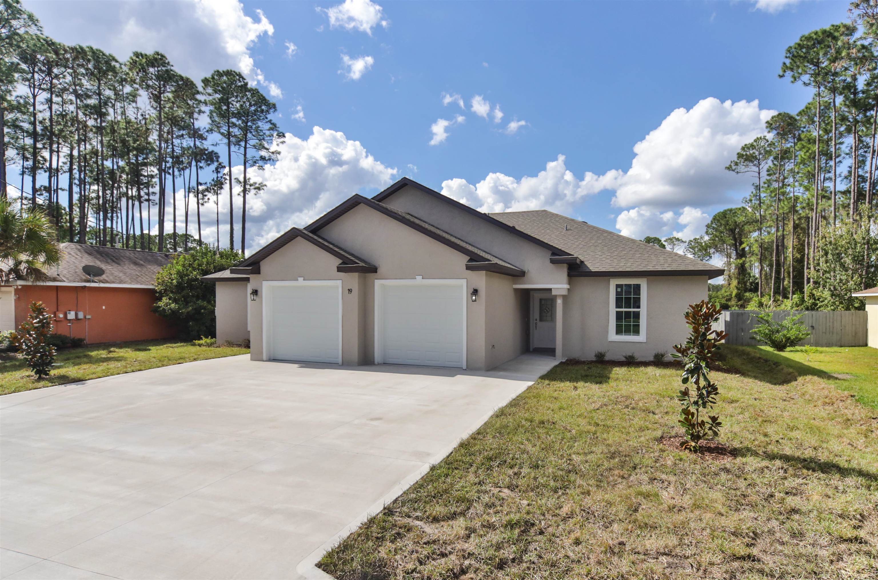 9 Seton Place Palm Coast, FL 32164 - Photo 2 of 37 a house view with a backyard space