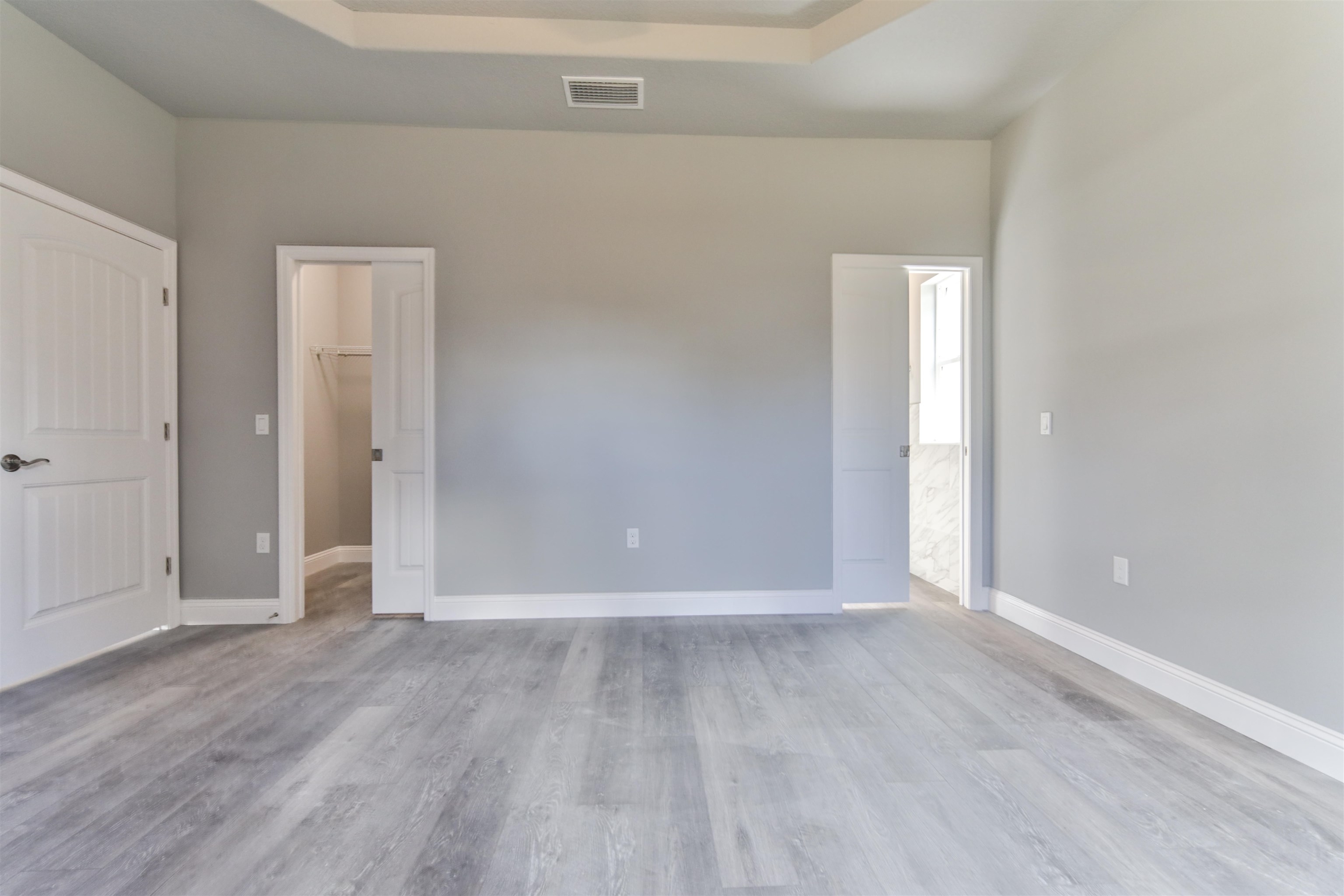 9 Seton Place Palm Coast, FL 32164 - Photo 21 of 37 a view of an empty room with wooden floor