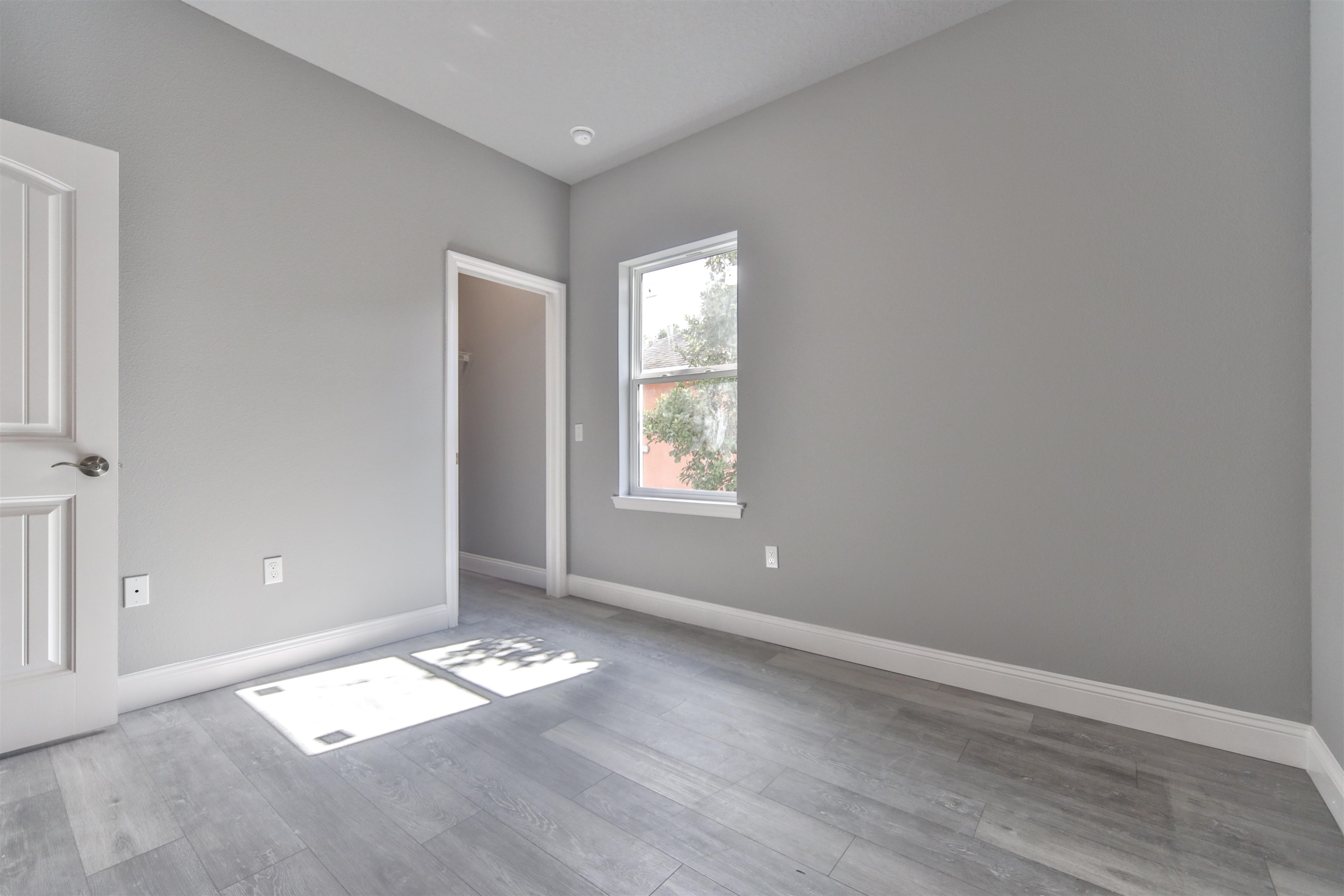 9 Seton Place Palm Coast, FL 32164 - Photo 29 of 37 an empty room with wooden floor and windows