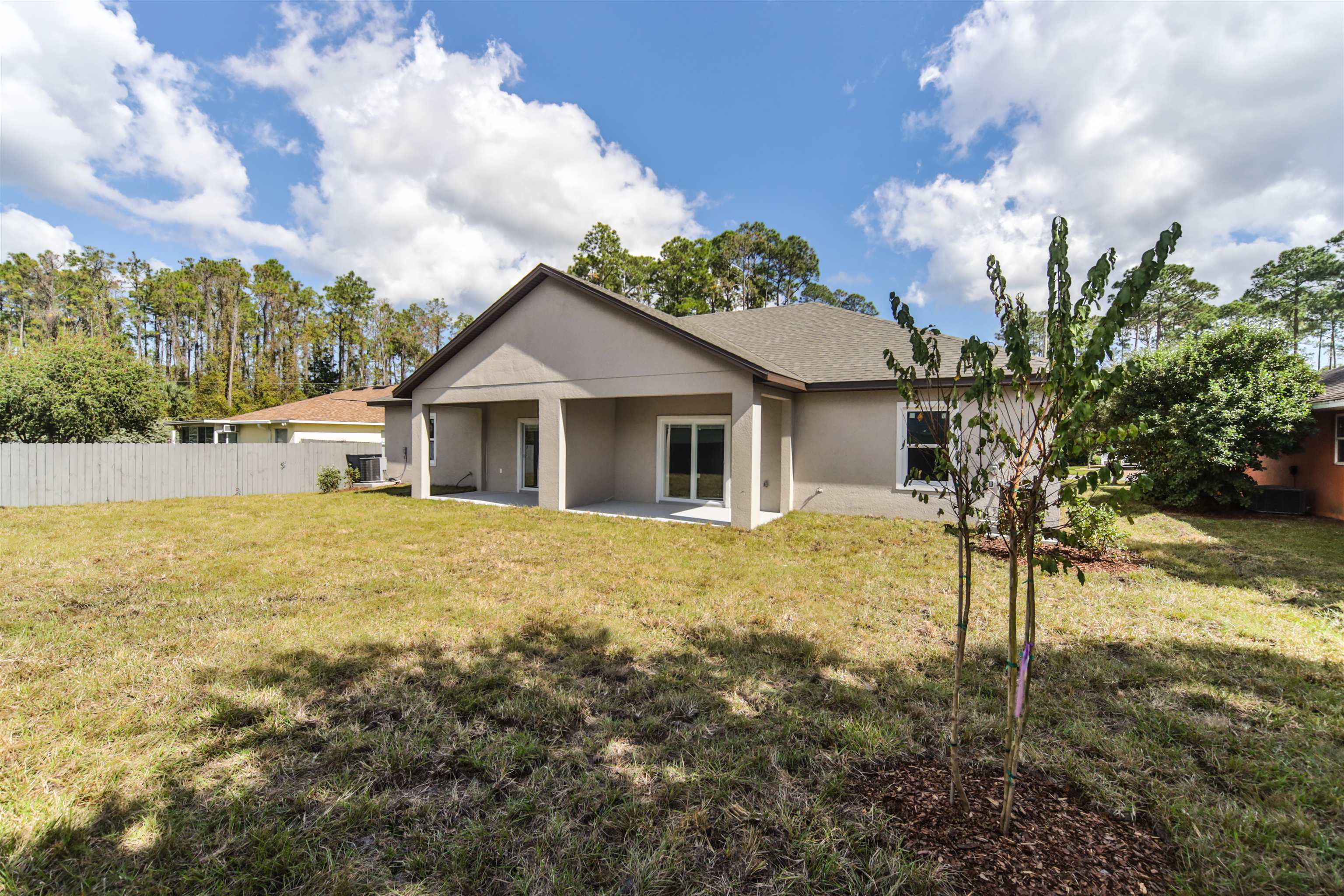 9 Seton Place Palm Coast, FL 32164 - Photo 33 of 37 a view of a house with backyard and garden