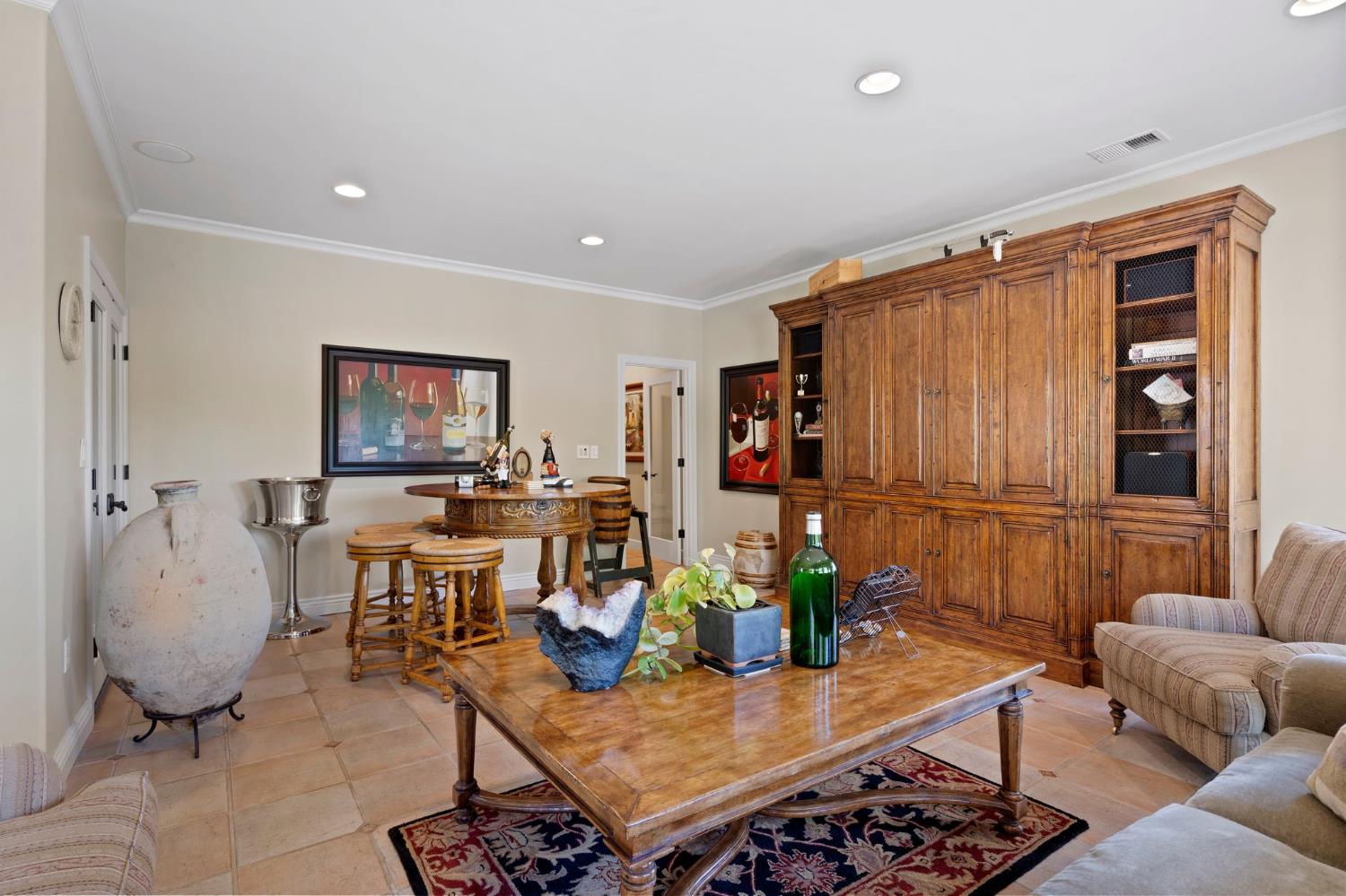 10676 Wilton Road Elk Grove, CA 95624 - Photo 21 of 71 a living room with furniture a dining table and a potted plant