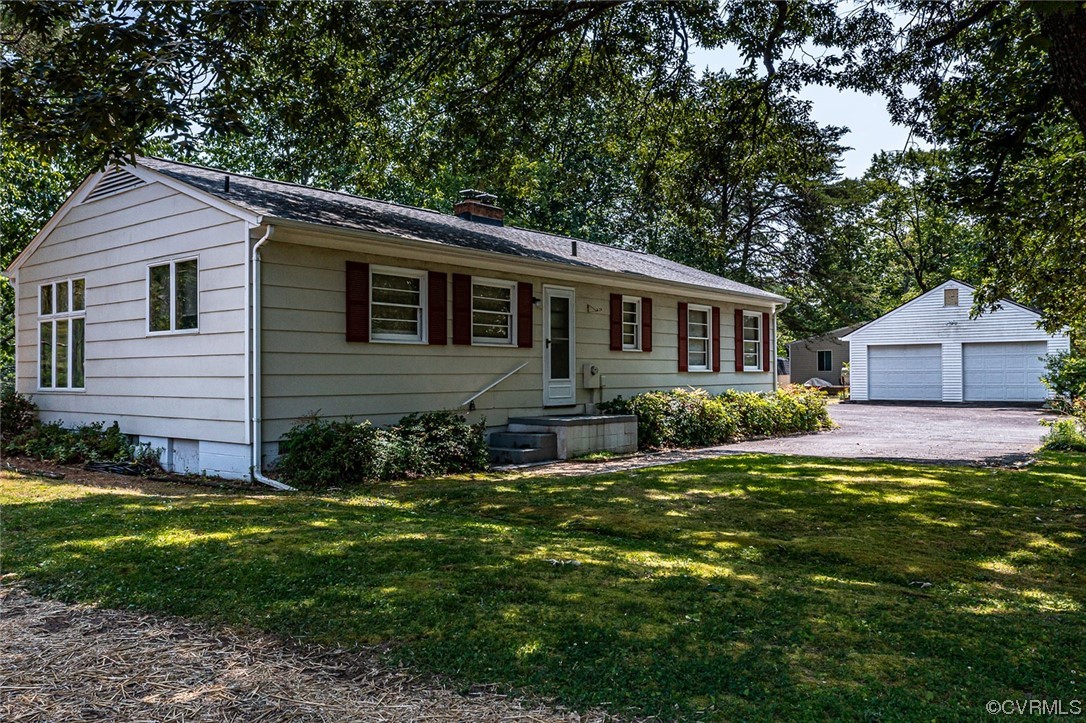 446 Hideaway Point Road Topping, VA 23169 - Photo 1 of 22 a house view with a garden space