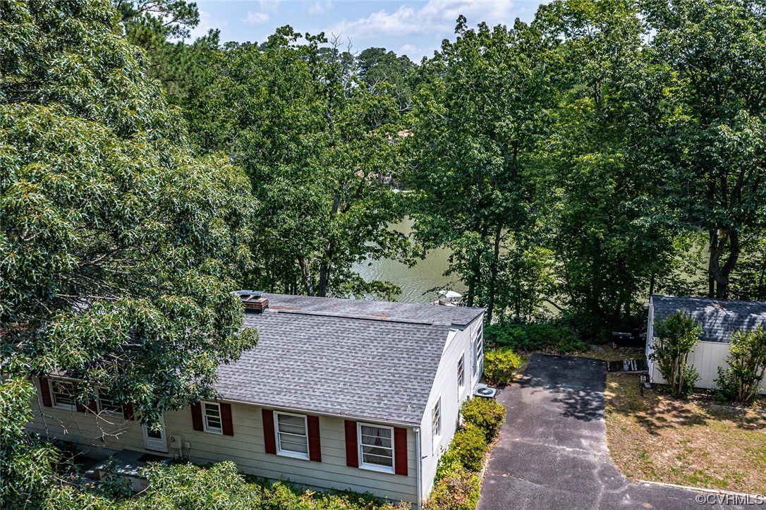 446 Hideaway Point Road Topping, VA 23169 - Photo 3 of 22 an aerial view of a house with a yard