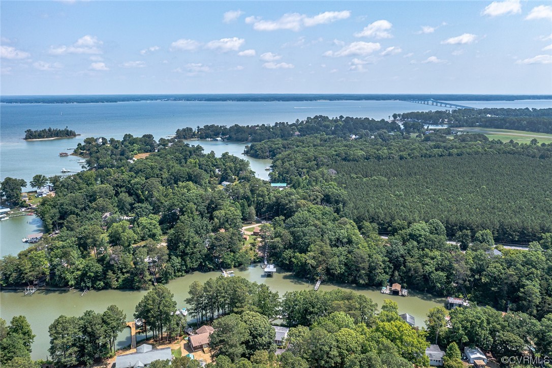 446 Hideaway Point Road Topping, VA 23169 - Photo 4 of 22 an aerial view of a city with lots of residential buildings and mountain view in back