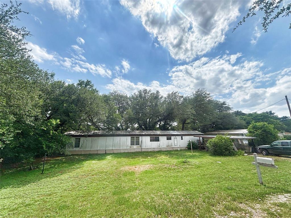 101 Riverview Road Millsap, TX 76066 - Photo 3 of 26 a view of a swimming pool with a yard