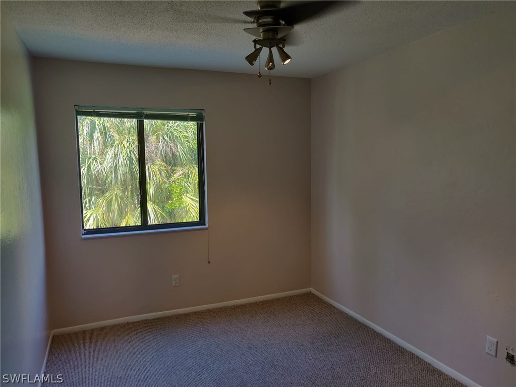 18132 Matanzas Road Fort Myers, FL 33967 - Photo 13 of 22 an empty room with a window
