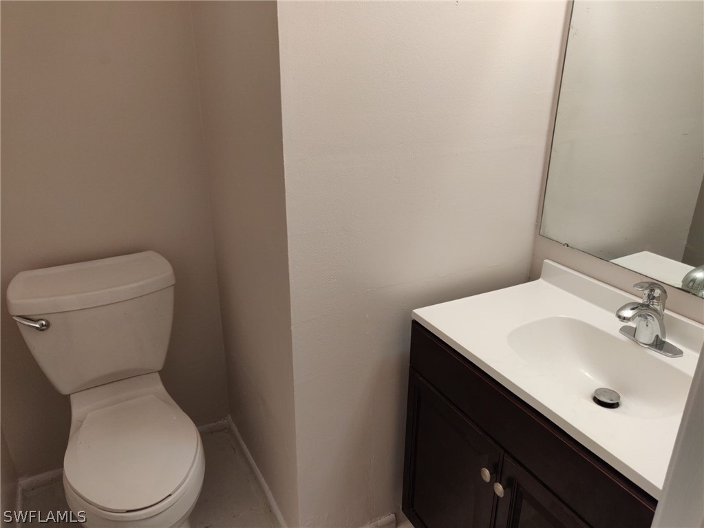 18132 Matanzas Road Fort Myers, FL 33967 - Photo 15 of 22 a white toilet sitting next to a bathroom sink