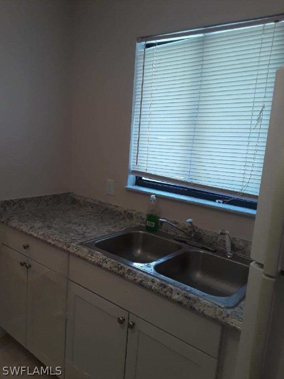 18132 Matanzas Road Fort Myers, FL 33967 - Photo 5 of 22 a kitchen with a sink and cabinets