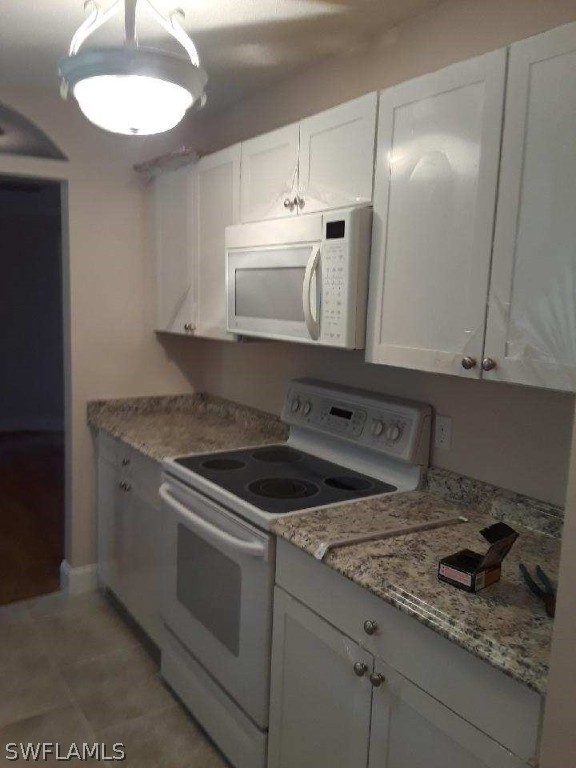 18132 Matanzas Road Fort Myers, FL 33967 - Photo 7 of 22 a kitchen with stainless steel appliances granite countertop a sink stove and cabinets