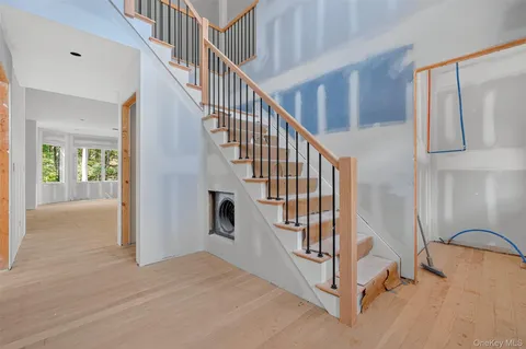 a view of entryway with wooden floor
