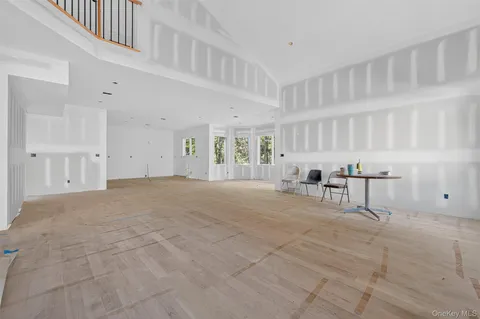 a view of an empty room with chandelier