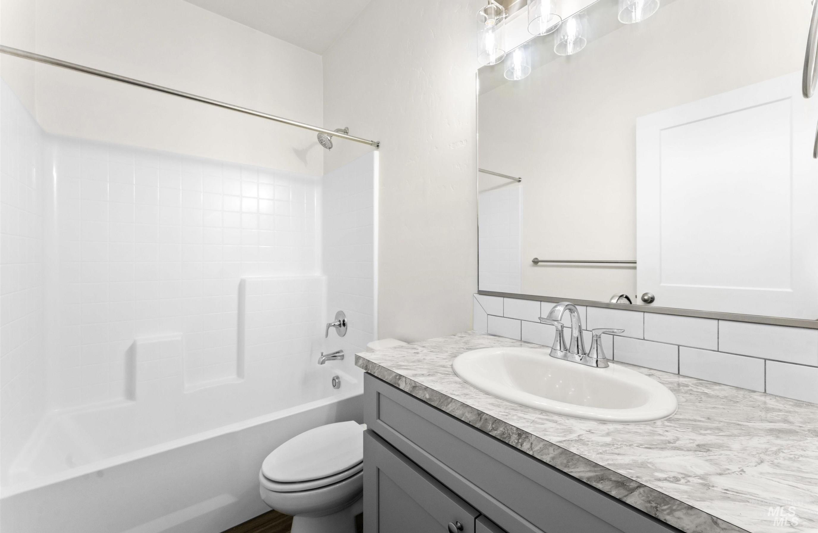 1771 Regency Way Emmett, ID 83617 - Photo 8 of 9 Full bath with vanity, bathtub / shower combination, and backsplash