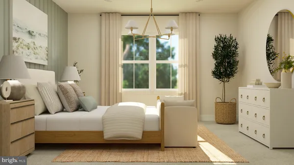 a bedroom with furniture and a large window