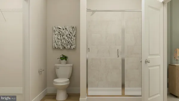a white toilet sitting next to a bathroom sink