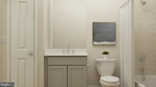 a bathroom with a toilet a sink and shower