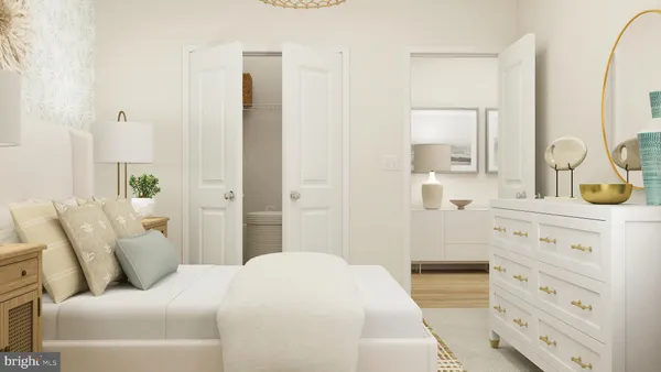 a bedroom with a bed and a dresser