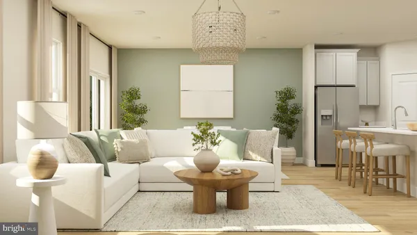 a living room with couches and a dining table with garden view