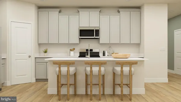 a white kitchen with a sink and cabinets
