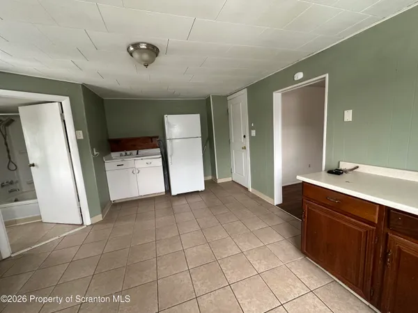 a view of a kitchen with cabinets
