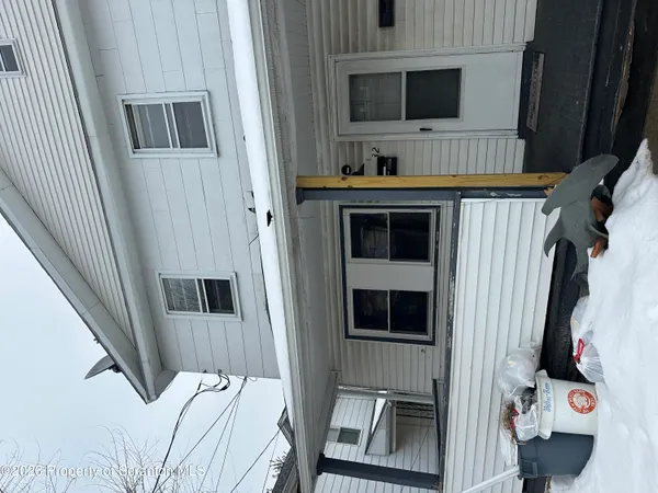 a bedroom with a bed and flat screen tv