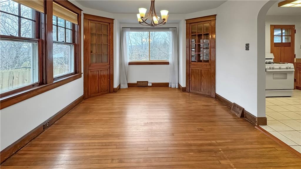 1601 Aurelius Avenue Pittsburgh, PA 15218 - Photo 12 of 30 a view of an empty room with wooden floor and a window