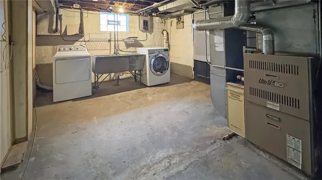 a utility room with dryer and washer