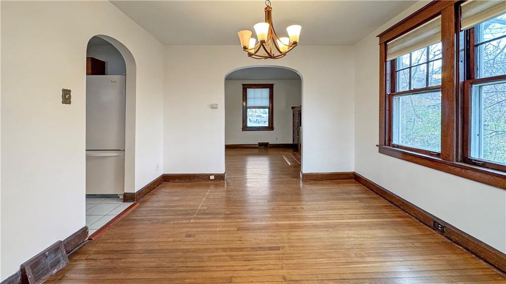 1601 Aurelius Avenue Pittsburgh, PA 15218 - Photo 21 of 30 a view of an empty room with wooden floor and a window