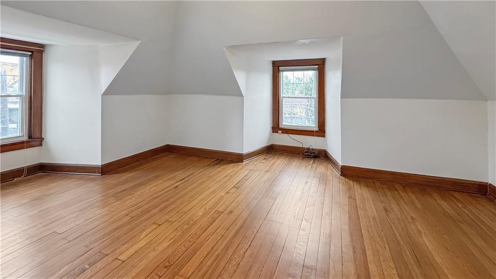 1601 Aurelius Avenue Pittsburgh, PA 15218 - Photo 27 of 30 an empty room with wooden floor and windows
