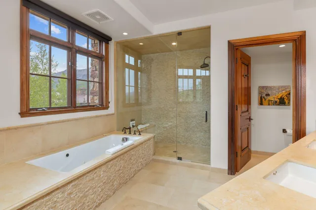 a bathroom with a bathtub and a sink