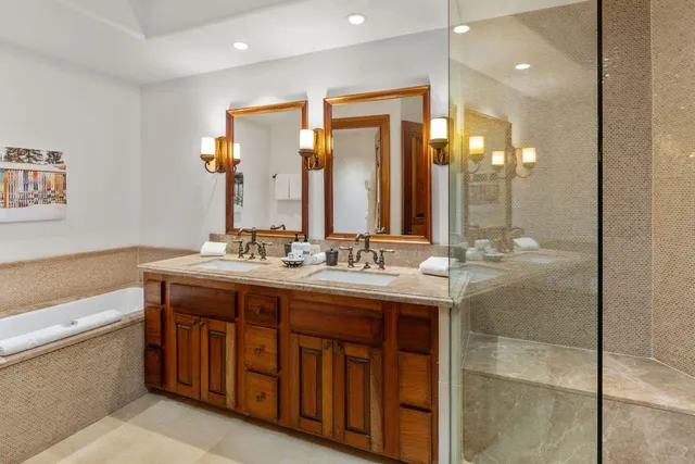 a view of a green field with sitting area