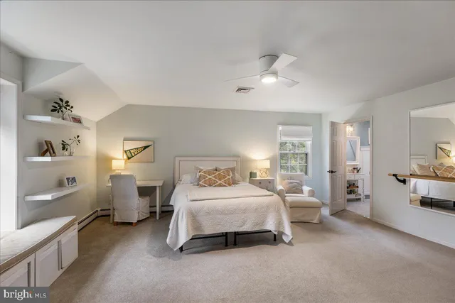 a bedroom with a bed and a couch