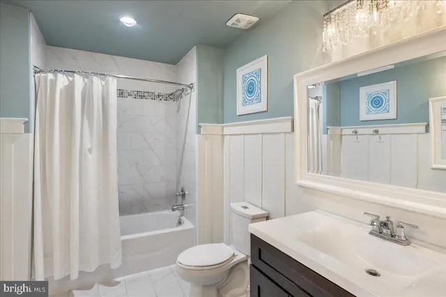 a bedroom with a bed and a cabinets