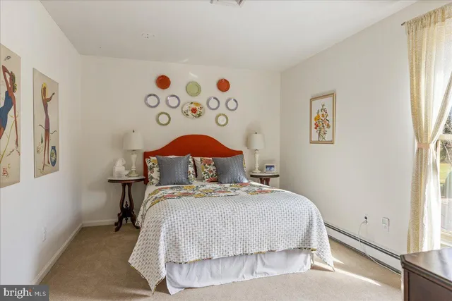 a bathroom with a tub and a window