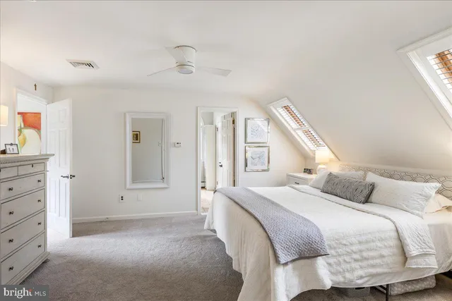 a view of a patio with a table chairs and a grill
