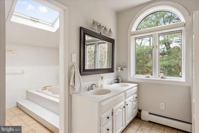 an aerial view of a house with yard