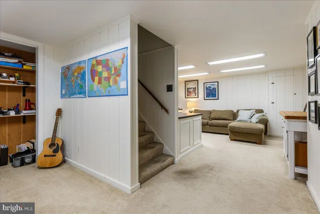 a view of a patio with a table and chairs under an umbrella