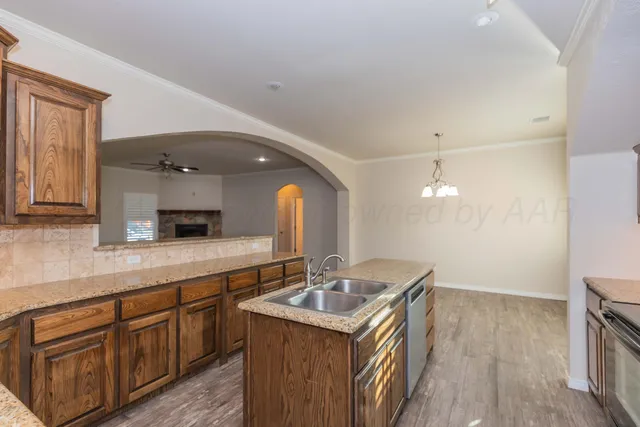 a kitchen with a sink and cabinets