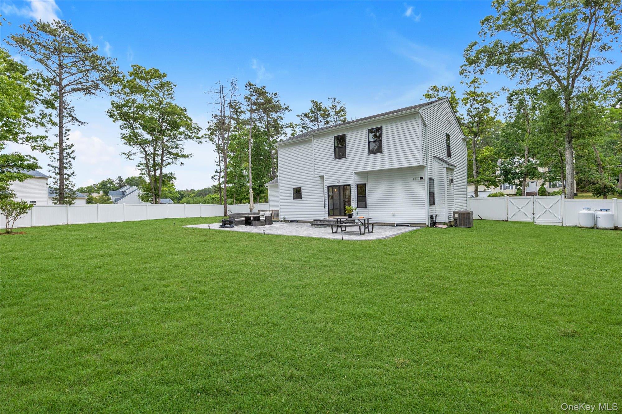 135 Elizabeth Way Ridge, NY 11961 - Photo 22 of 24 a view of house with backyard